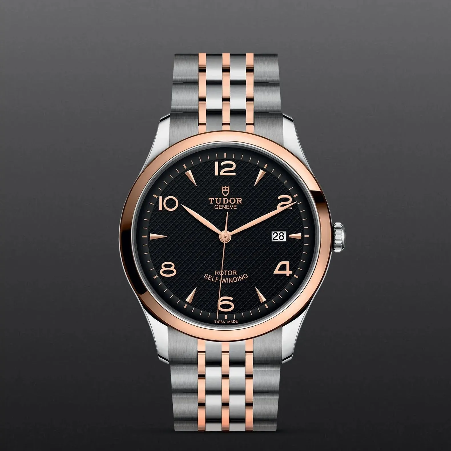 M91651-0003 Tudor 1926 41 mm 18 kt Rose Gold And Stainless Steel Automatic Watch. The Watch Has A Smooth Gold  Bezel, Steel Case, Black Dial With Arabic Numbers, Date At 3 O'clock And A Rose Gold And Steel Bracelet With A Safety Clasp.