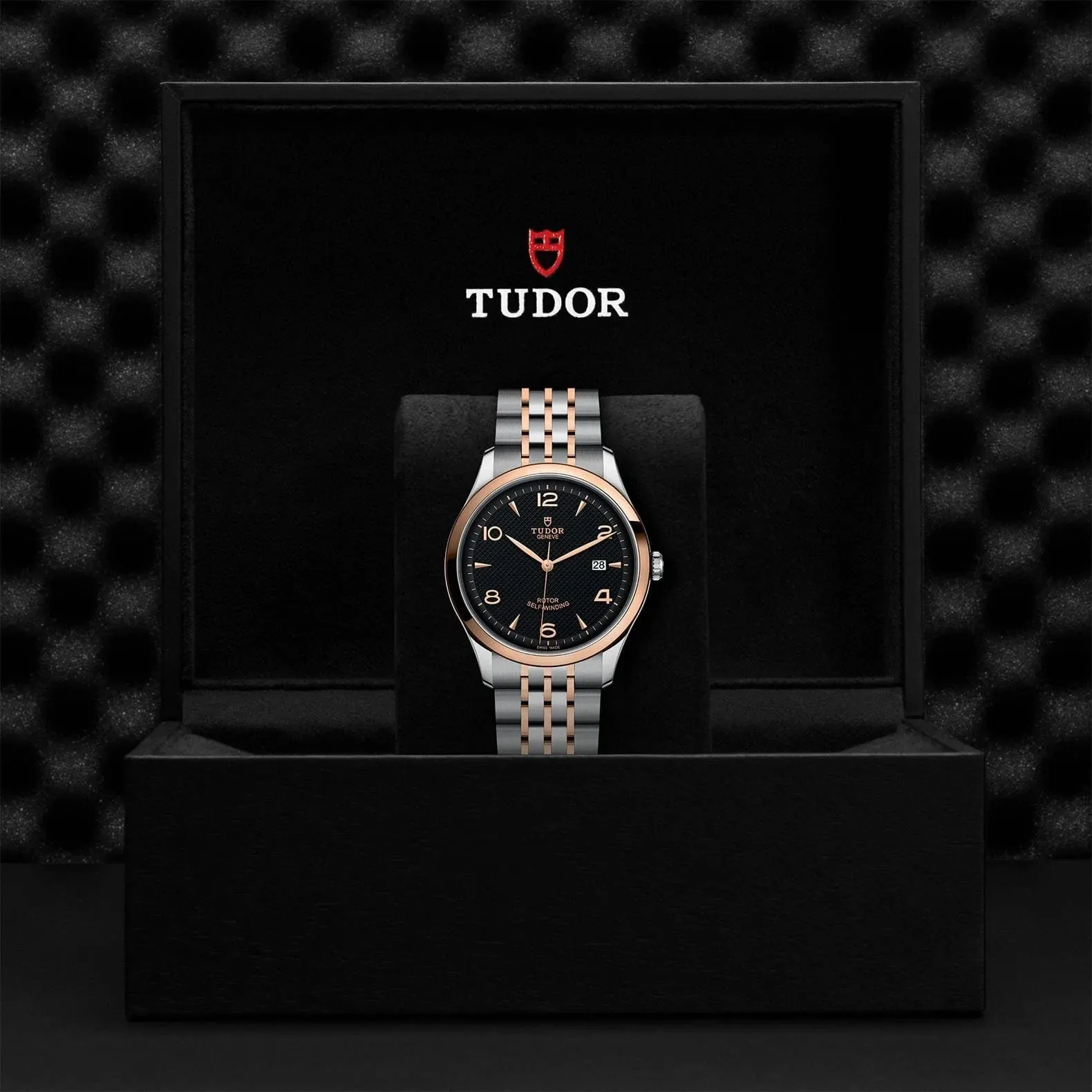 M91651-0003 Tudor 1926 41 mm 18 kt Rose Gold And Stainless Steel Automatic Watch. The Watch Has A Smooth Gold  Bezel, Steel Case, Black Dial With Arabic Numbers, Date At 3 O'clock And A Rose Gold And Steel Bracelet With A Safety Clasp.